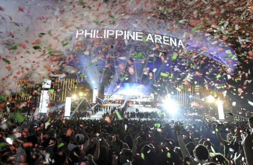 Confetti rains down on revelers in the Philippines as the clock strikes midnight on New Year's Eve