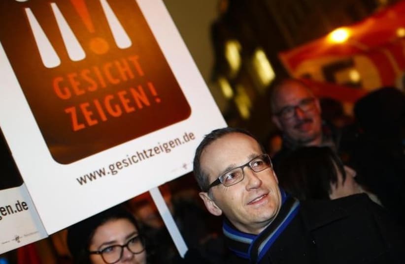 German Justice Minister Heiko Maas takes part in a protest against the march of a grass-roots anti-Muslim movement in Berlin