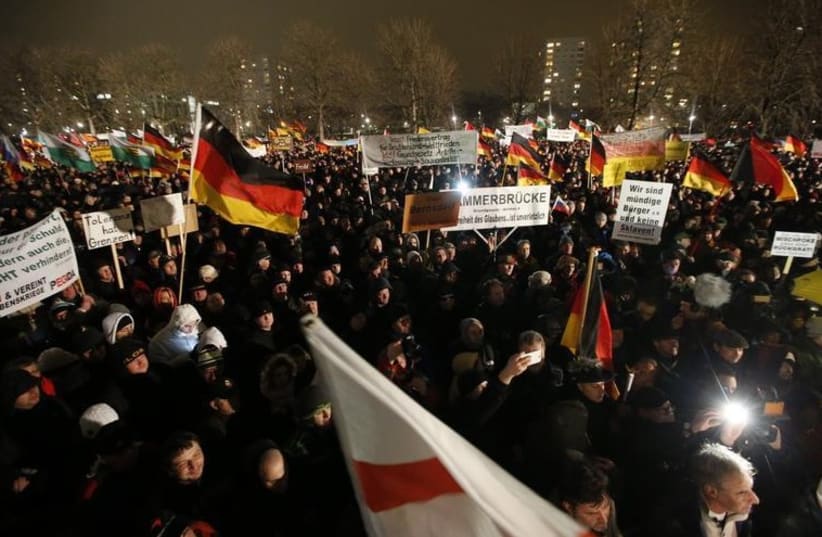 Participants take part in a demonstration called by anti-immigration group PEGIDA, a German abbreviation for ''Patriotic Europeans against the Islamization of the West'', in Dresden