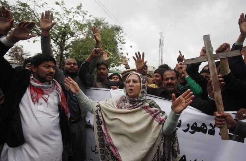 People from the Christian community attend a protest, to condemn suicide bombings which took place outside two churches in Lahore, in Peshwar, March 16, 2015.