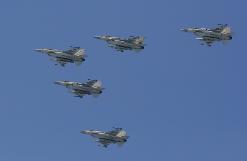 IAF planes fly during an aerial show over the Mediterranean Sea as seen from a Tel Aviv beach, as part of Independence Day celebrations, April 23, 2015