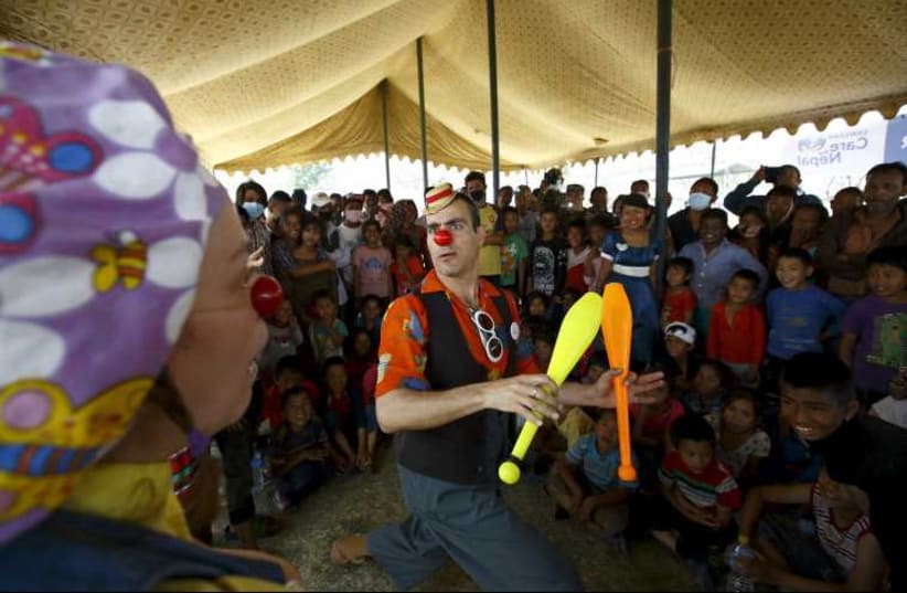 Medical clowns perform in front of children affected by earthquake in Kathmandu.