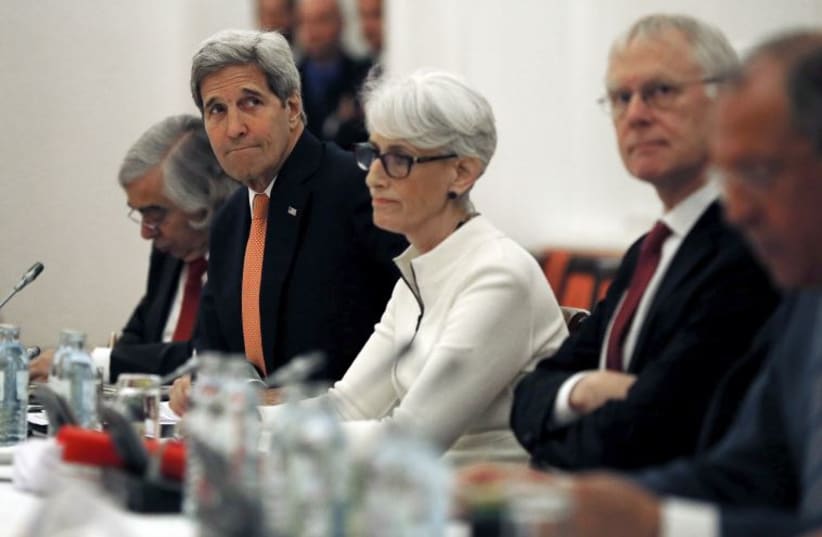 U.S. Secretary of State John Kerry (2nd L) meets with foreign ministers and delegations from Germany, France, China, Britain, Russia and the European Union at a hotel in Vienna, Austria July 13, 2015. 