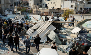  Palestinians inspect the damage following an Israeli raid in Jenin in the West Bank January 26, 2023. 