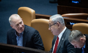  Defense Minister Yoav Gallant speaks with Israeli Prime Minister Benjamin Netanyahu during a vote in the assembly hall of the Knesset, the Israeli parliament in Jerusalem, on February 15, 2023