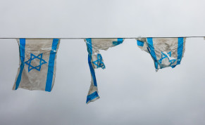 Torn Israeli flags are seen in this illustrative photo taken on March 22, 2023