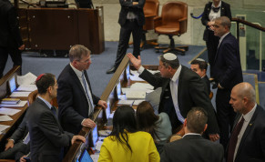  Israeli MKs are seen in the Knesset plenum following a day of voting on March 22, 2023